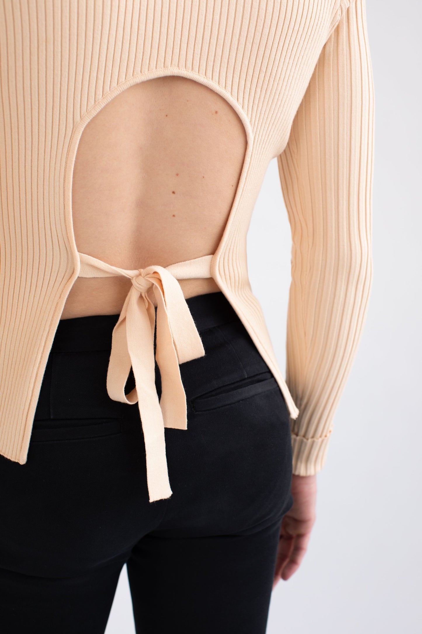 FANG: Bow Back Sweater